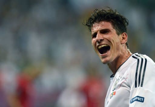 German forward Mario Gomez celebrates after scoring a goal during the Euro 2012 football match against Portugal. Germany won 1-0