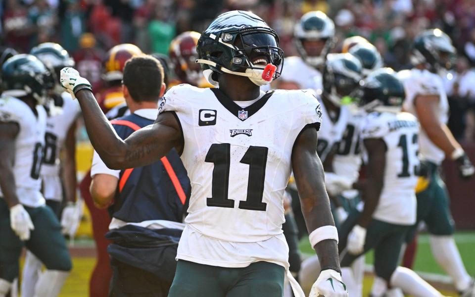 Oct 29, 2023; Landover, Maryland, USA; Philadelphia Eagles wide receiver A.J. Brown (11) celebrates after a touchdown against the Washington Commanders during the second half at FedExField. Mandatory Credit: Brad Mills-USA TODAY Sports