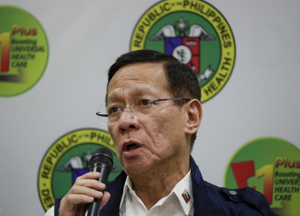 In this Feb. 6 photo, Philippine Health Secretary Francisco Duque III speaks during a press conference on the new coronavirus in Manila, Philippines on Thursday, Feb. 6, 2020. Duque is in home quarantine after being exposed to a health officer infected with the new coronavirus. For most people, the new coronavirus causes only mild or moderate symptoms. For some, it can cause more severe illness, especially in older adults and people with existing health problems. (AP Photo/Aaron Favila)