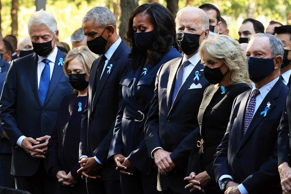 (L-R) Former President Bill Clinton, former First Lady Hillary Clinton, former President Barack Obama, former First Lady Michelle Obama, President Joe Biden, First Lady Jill Biden, former New York City Mayor Michael Bloomberg, Bloomberg's partner Diana Taylor and Speaker of the House Nancy Pelosi (D-CA) participate in a moment of silence during the annual 9/11 Commemoration Ceremony at the National 9/11 Memorial and Museum on September 11, 2021 in New York.