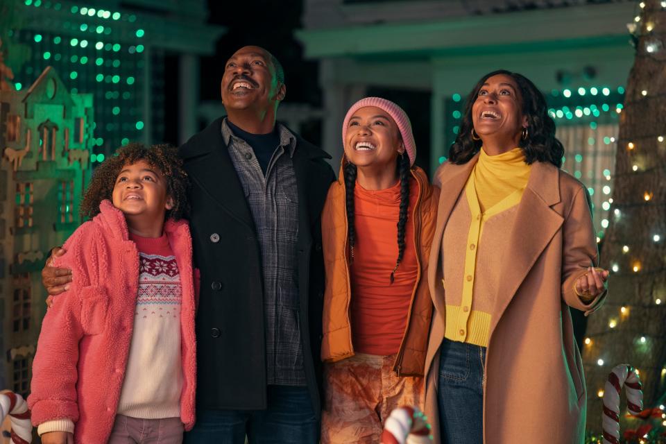 Eddie Murphy (with Madison Thomas, Genneya Walton and Tracee Ellis Ross) plays a determined man who makes a deal with a mischievous elf to help win his neighborhood's Christmas decorating contest in the comedy "Candy Cane Lane."