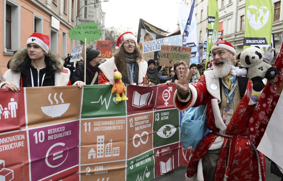 Climate activists attend the March for Climate in a protest against global warming in Katowice, Poland, Saturday, Dec. 8, 2018, as the COP24 UN Climate Change Conference takes place in the city. (AP Photo/Alik Keplicz)