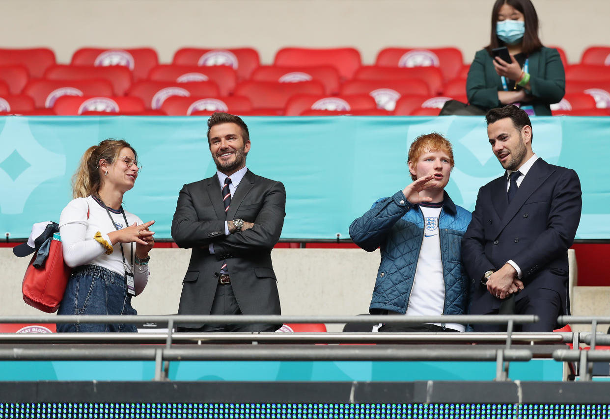 LONDON, ENGLAND - JUNE 29: (L-R) Cherry Seaborn, Wife of Ed Sheeran, David Beckham and Ed Sheeran are seen in the stands with a guest at half time during the UEFA Euro 2020 Championship Round of 16 match between England and Germany at Wembley Stadium on June 29, 2021 in London, England. (Photo by Alex Morton - UEFA/UEFA via Getty Images)