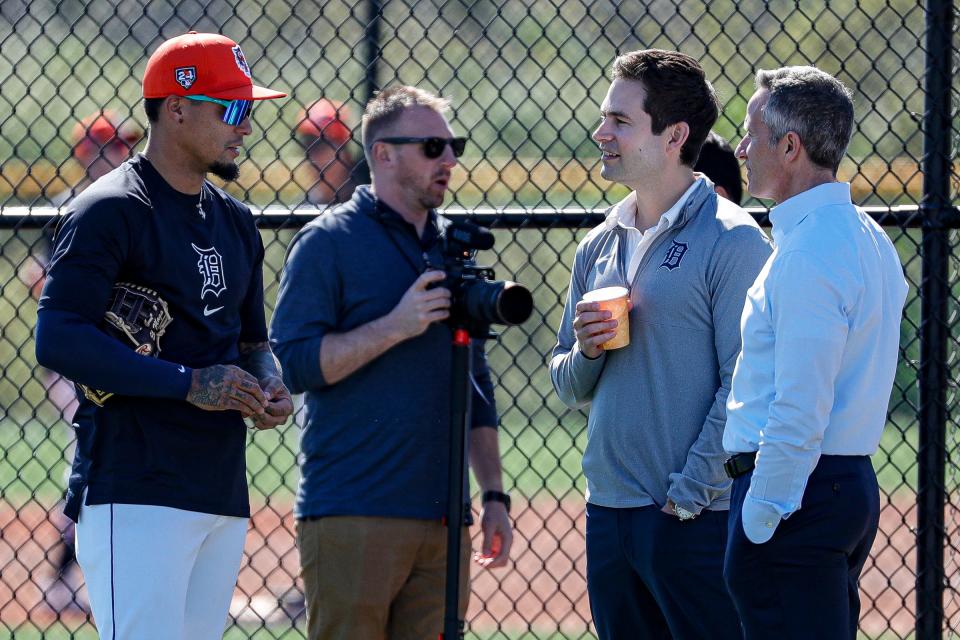 Detroit Tigers shortstop Javier Baez talks to president of baseball operations Scott Harris and chairman and CEO Chris Ilitch during spring training at TigerTown in Lakeland, Fla. on Tuesday, Feb. 20, 2024.