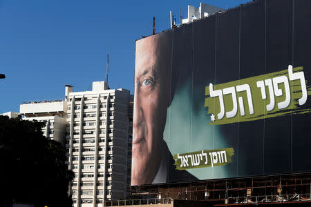 A part of a campaign billboard of Benny Gantz, a former Israeli armed forces chief and the head of a new political party, Israel Resilience, can be seen in Tel Aviv, Israel January 29, 2019. REUTERS/Ronen Zvulun