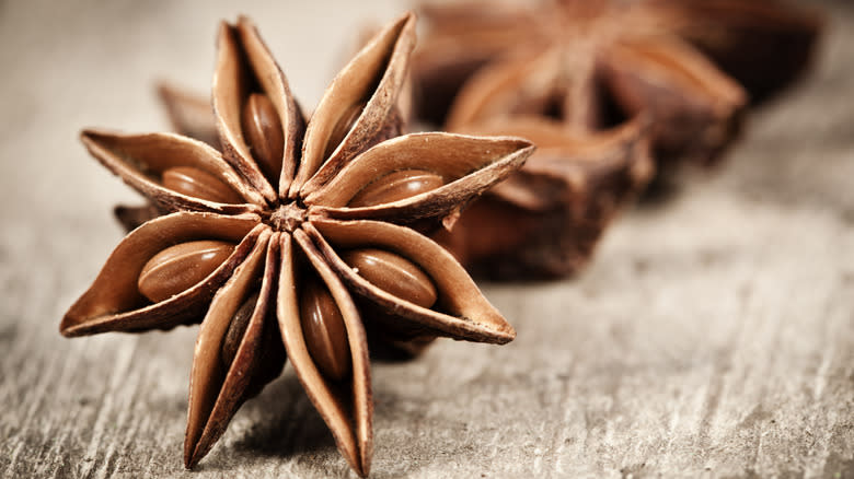 Star anise on wooden spoon