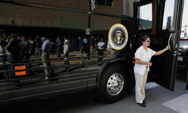 A Secret Service agent guards the door to the bus used for campaigning in Iowa by U.S. President Barack Obama in Knoxville, Iowa, August 14, 2012.