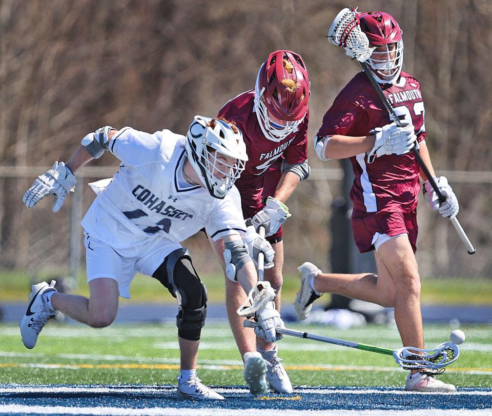 Cohasset mid fielder Henry Burke lunges for the loose ball near the Falmouth net.

The Chowda Cup, a boys lacrosse tournament hosted by Cohasset in action on Tuesday April 16, 2024