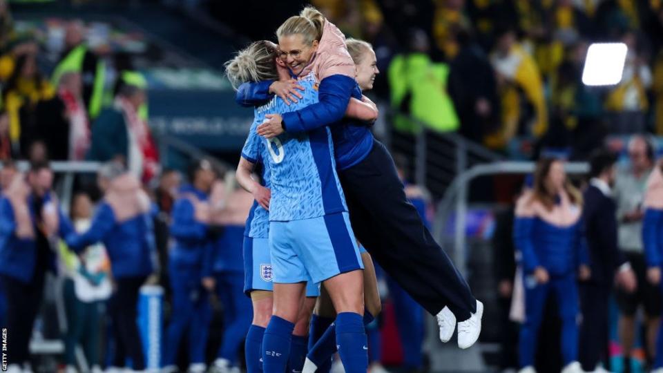 England captain Millie Bright celebrates with manager Sarina Wiegman