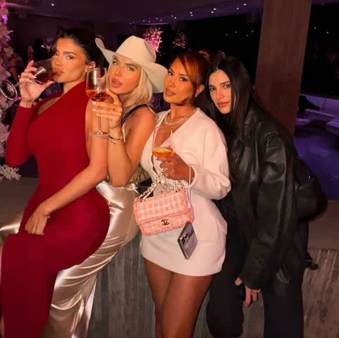 <p>Kylie Jenner/Instagram</p> Kylie Jenner poses with friends at her perfume launch party.