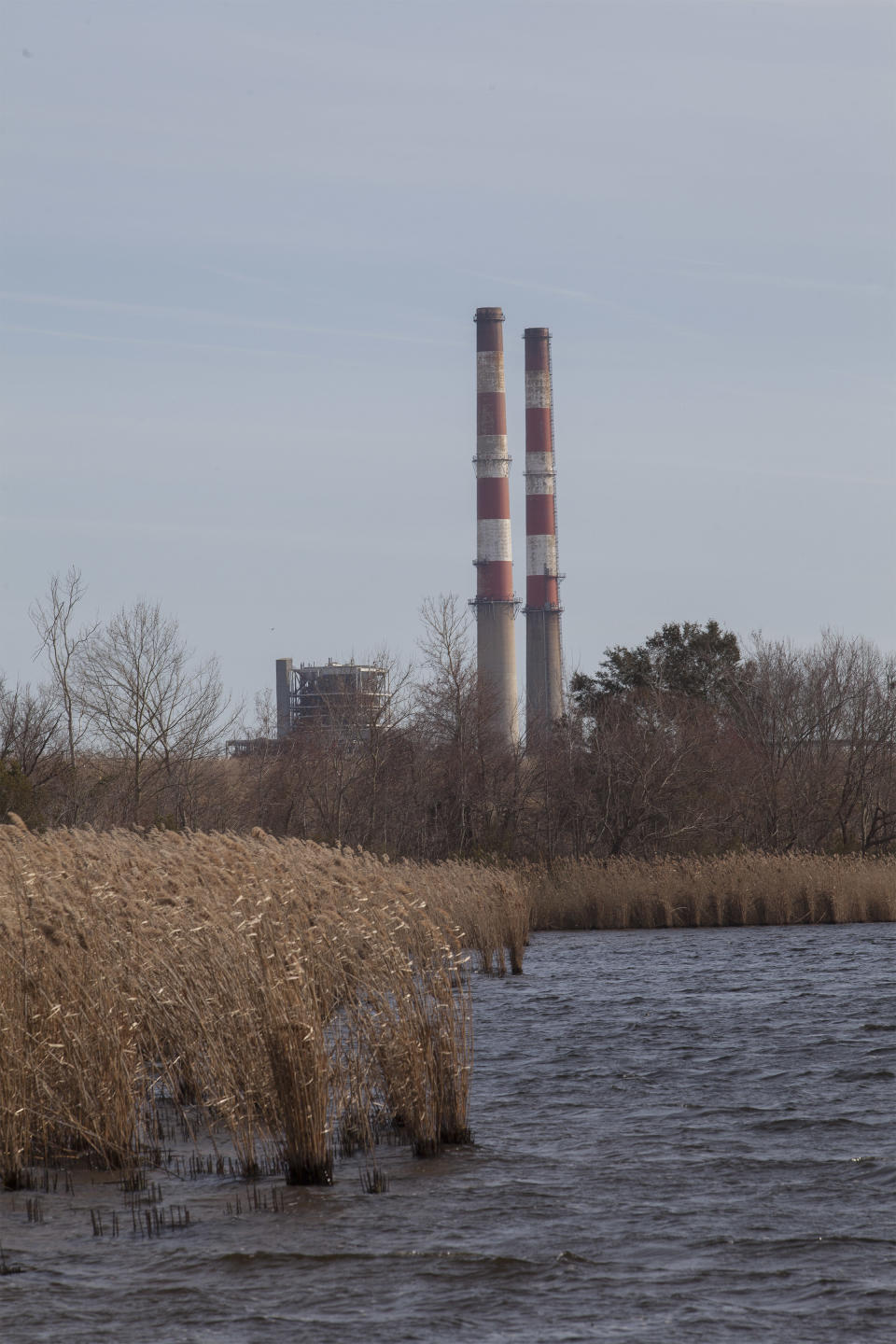 Photo shows the L.V. Sutton Complex operated by Duke Energy from the Sutton Lake landing in Wilmington, N.C., on Wednesday, Feb. 19, 2014. Members of the Flemington Road community near the plant, feel the facility could be polluting well water with spill off and seepage from large coal ash ponds. (AP Photo/Randall Hill)