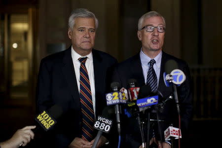 Lawyer Robert Gage (R) speaks to the media with his client former New York state Senate Majority Leader Dean Skelos as they exit the Manhattan federal court house in New York December 10, 2015. REUTERS/Brendan McDermid