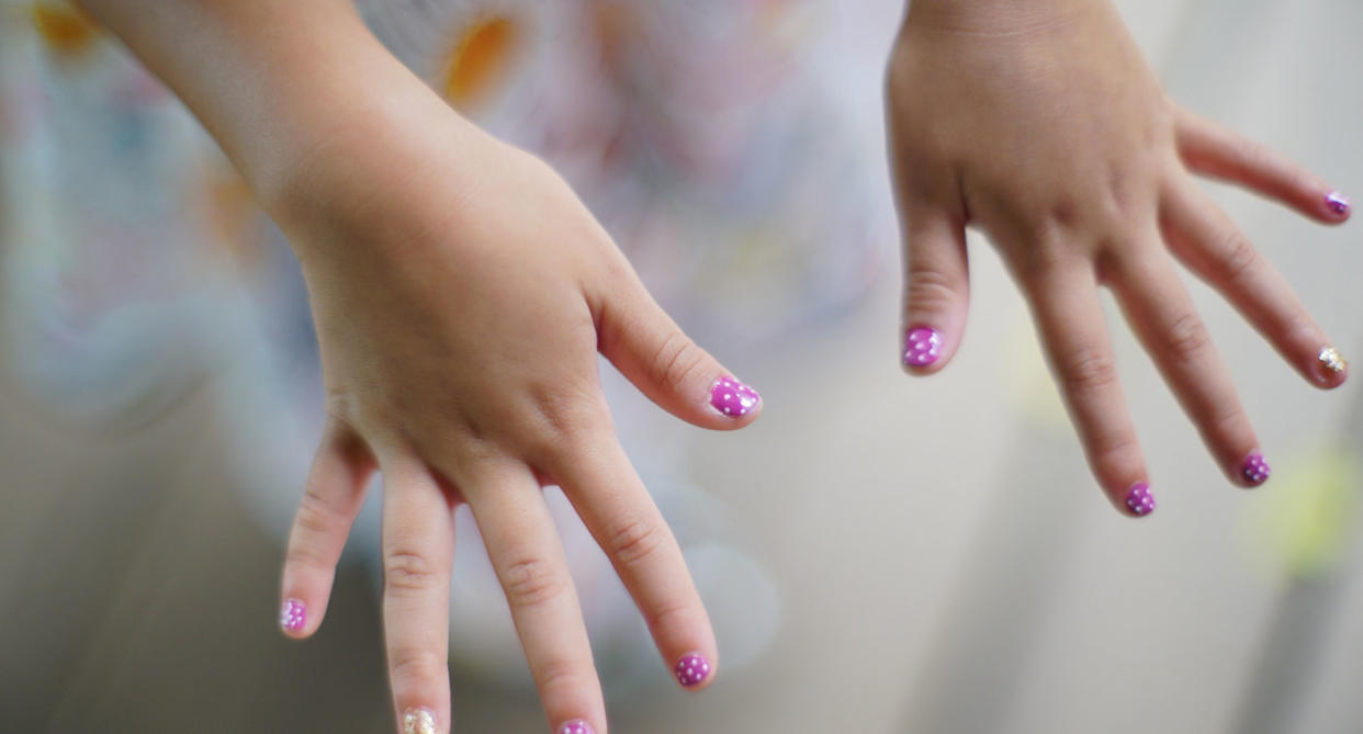 <em>A U.K. school has “banned” long fingernails.</em>