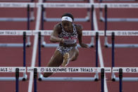 Keni Harrison wins the the second semi-final in the women's 100-meter hurdles at the U.S. Olympic Track and Field Trials Sunday, June 20, 2021, in Eugene, Ore. (AP Photo/Ashley Landis)