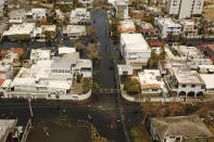 <p>Flooded streets in San Juan on Sept. 25, 2017. Nearly one week after hurricane Maria devastated the island of Puerto Rico, residents are still trying to get the basics of food, water, gas, and money from banks. Much of the damage done was to electrical wires, fallen trees, and flattened vegetation, in addition to home wooden roofs torn off. (Photo: Carolyn Cole/Los Angeles Times via Getty Images) </p>