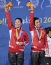 Canadian Meaghan Benfeito (L) and Roseline Filion pose on the podium with the silver medal of the women´s 10m synchronised platform during the XVI Pan American Games Guadalajara 2011 in Guadalajara, Mexico, on October 27, 2011. AFP PHOTO / RODRIGO BUENDIA (Photo credit should read RODRIGO BUENDIA/AFP/Getty Images)