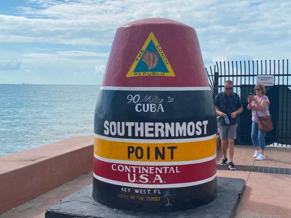 Key West’s Southernmost Point buoy landmark attracts visitors on Friday, Jan. 7, 2022. City workers finished repainting the buoy the night before, days after it was vandalized.
