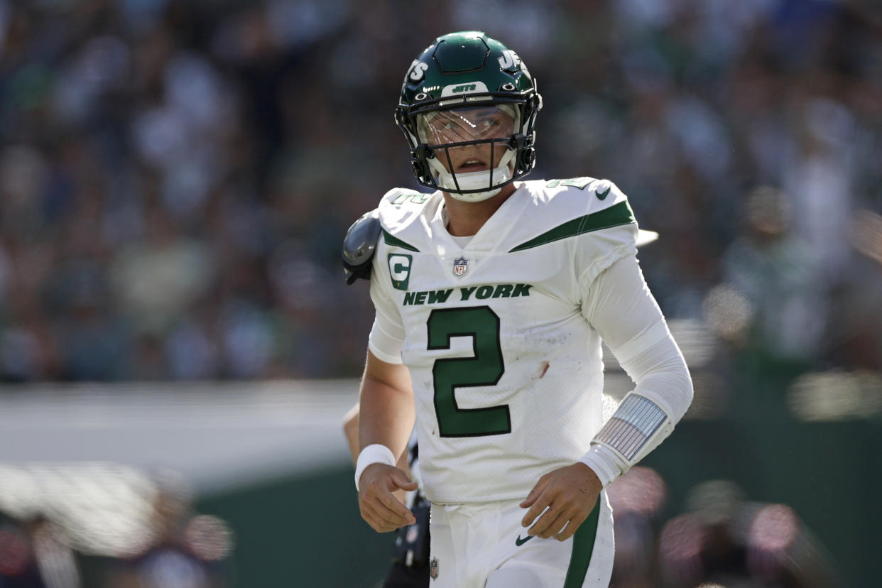 New York Jets quarterback Zach Wilson (2) runs off the field against the New England Patriots during an NFL football game, Sunday, Sept. 19, 2021, in East Rutherford, N.J. (AP Photo/Adam Hunger)