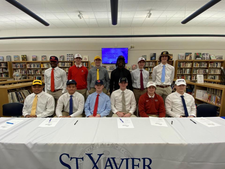 St. Xavier High School hosted a Signing Day ceremony for its athletes signing to play college sports. They are, from left: front, Marque’ Cummings, football, Tiffin University; Charles Kellom, football, Akron University; Eli Kirk, football, University of Dayton; Max Klare, football, Purdue University; Brady Manahan, soccer, Transylvania University; and Brogan McCaughey, football, Yale University. Back, Josh Anderson, football, University of Dayton; Tanner Creech, soccer, Ohio State University; Brennan Bareswilt, football, Centre College; Terrell McFarlin, football, University of Findlay; Carter Posey, soccer, University of Indianapolis and Evan Weyler, baseball, Centre College