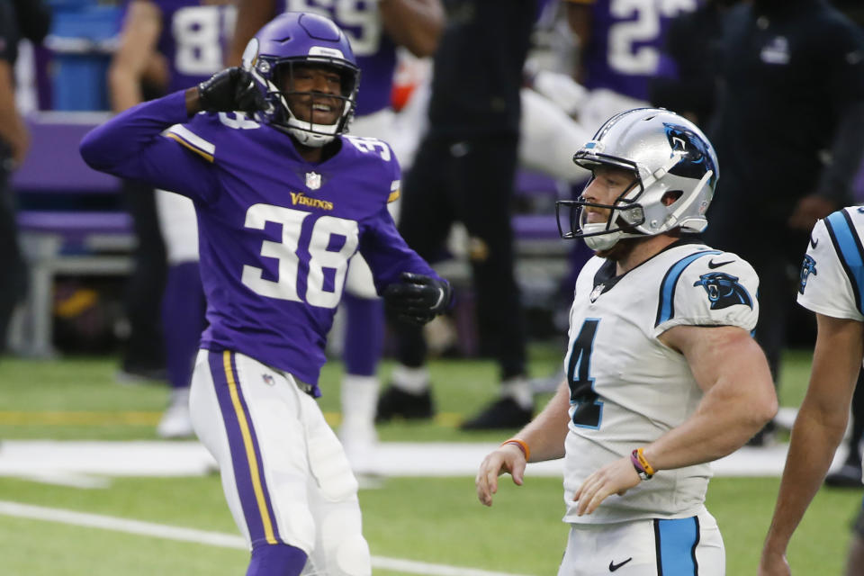 Carolina Panthers place kicker Joey Slye, right, reacts in front of Minnesota Vikings' Harrison Hand, left, after missing a field goal at the end of an NFL football game, Sunday, Nov. 29, 2020, in Minneapolis. The Vikings won 28-27. (AP Photo/Bruce Kluckhohn)