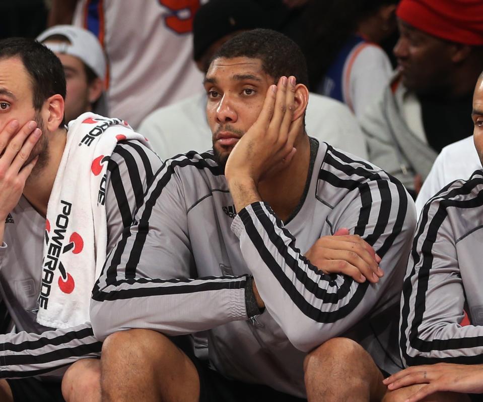 NEW YORK, NY - JANUARY 03: Tim Duncan #21 of the San Antonio Spurs sits on the bench in the closing minutes of the game after being injured against the New York Knicks at Madison Square Garden on January 3, 2013 in New York City. NOTE TO USER: User expressly acknowledges and agrees that, by downloading and/or using this photograph, user is consenting to the terms and conditions of the Getty Images License Agreement. The Knicks defeated the Spurs 100-83. (Photo by Bruce Bennett/Getty Images)