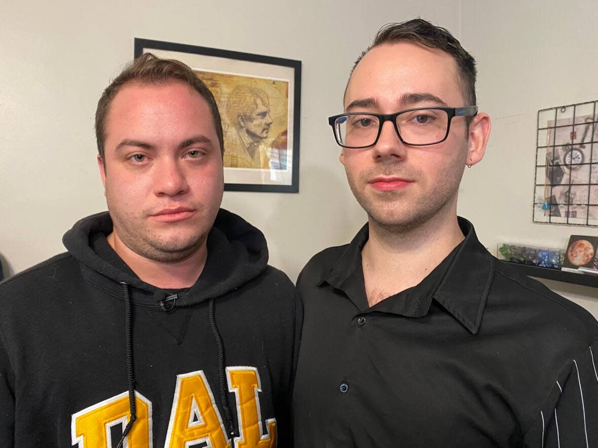 Emmett Paul, left, and Erik Saulnier say someone could have been hurt when a confused, disoriented woman entered their home on Monday. They say mental health professionals, rather than police, should be taking up such cases. (Carolyn Ray/CBC - image credit)