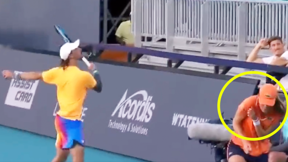 Aussie tennis player Jordan Thompson (pictured left) hitting a ball into the stands as a ball girl (pictured right) scrambles for cover.