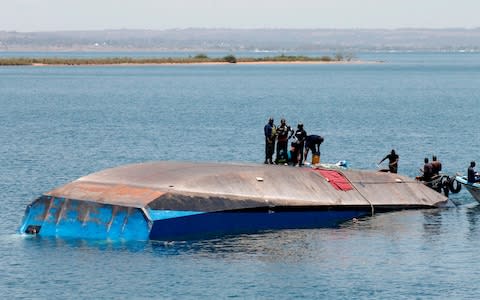 Tanzanian rescue workers search for victims  - Credit: AFP