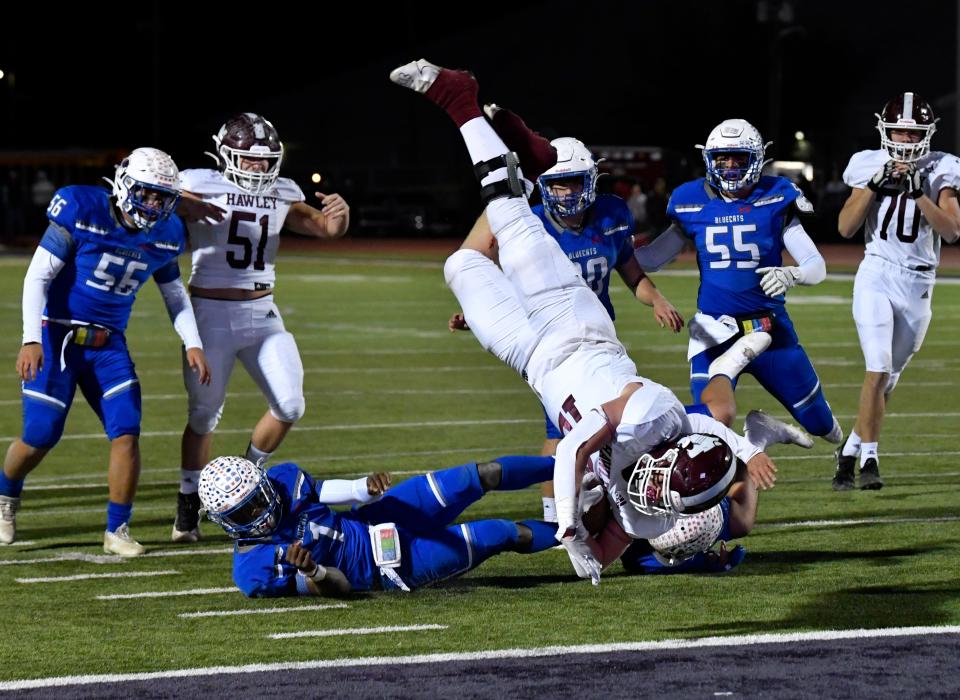 Hawley running back Austin Cumpton dives for a touchdown in the Coleman end zone during Friday's Region I-2A Division I semifinals game at Wylie High School. Final score was 21-7, Hawley.