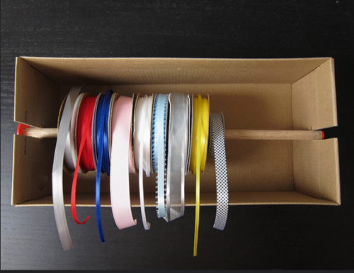 using a old shoebox to organize spools of ribbon