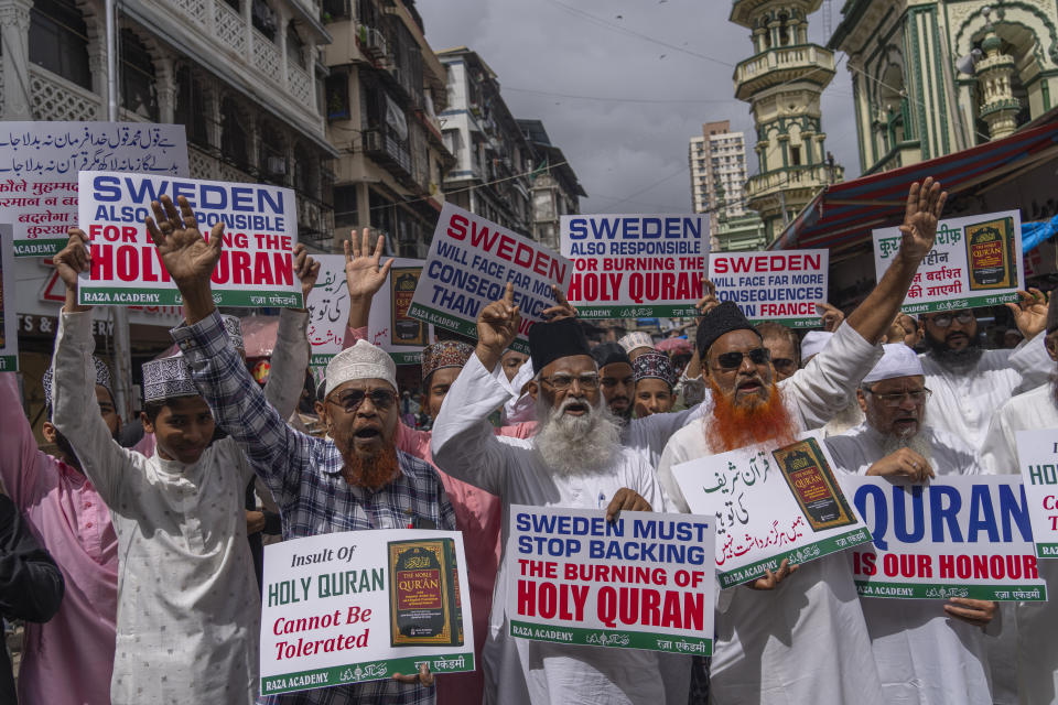 Indian Muslims hold placards and shout slogans condemning the desecration of Islam's holy book 'Quran' in Sweden, during a demonstration in Mumbai, India, Monday, July 3, 2023. (AP Photo/Rafiq Maqbool)