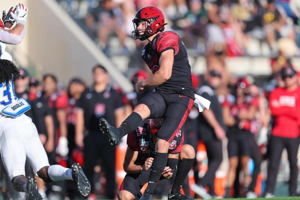 Jack Browning (13) of the San Diego State Aztecs misses a field goal attempt during the first half of the EasyPost Hawaii Bowl at the Clarence T.C. Ching Athletics Complex in Honolulu on Dec. 24, 2022. The team was playing the Middle Tennessee Blue Raiders.