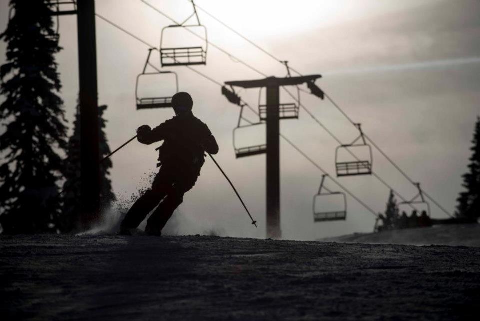 A skier makes turns in front of the old Skyline Express Triple<p>Photo: Indy Pass Media Kit/Ski Bluewood</p>
