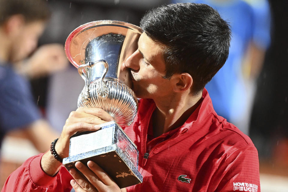 Serbia's Novak Đjoković kisses his trophy after winning his match with Argentina's Diego Sebastián Schwartzman during their final match at the Italian Open tennis tournament, in Rome, Monday, Sept. 21, 2020. (Alfredo Falcone/LaPresse via AP)