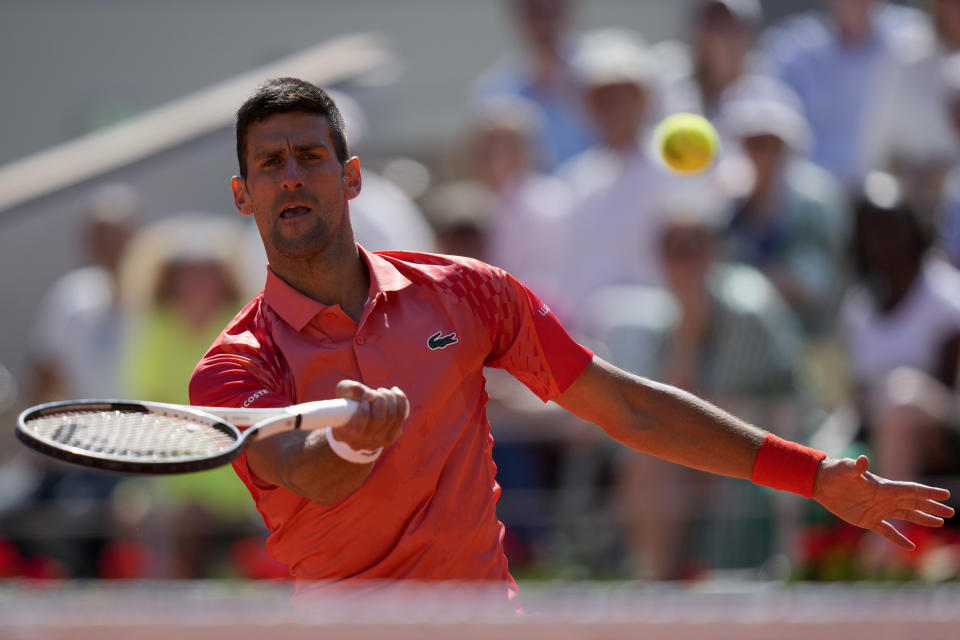 Serbia's Novak Djokovic plays a shot against Peru's Juan Pablo Varillas during their fourth round match of the French Open tennis tournament at the Roland Garros stadium in Paris, Sunday, June 4, 2023. (AP Photo/Thibault Camus)