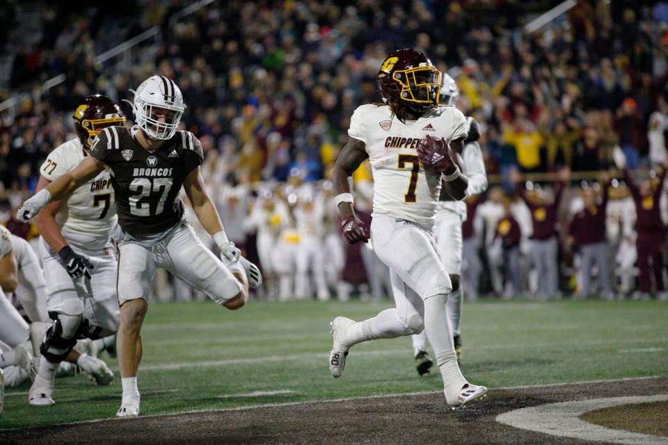 Central Michigan running back Lew Nichols III (7) scores a touchdown against Western Michigan during an NCAA college football game Wednesday, Nov. 3, 2021, in Kalamazoo, Mich. (Carlin Stiehl/Kalamazoo Gazette via AP)