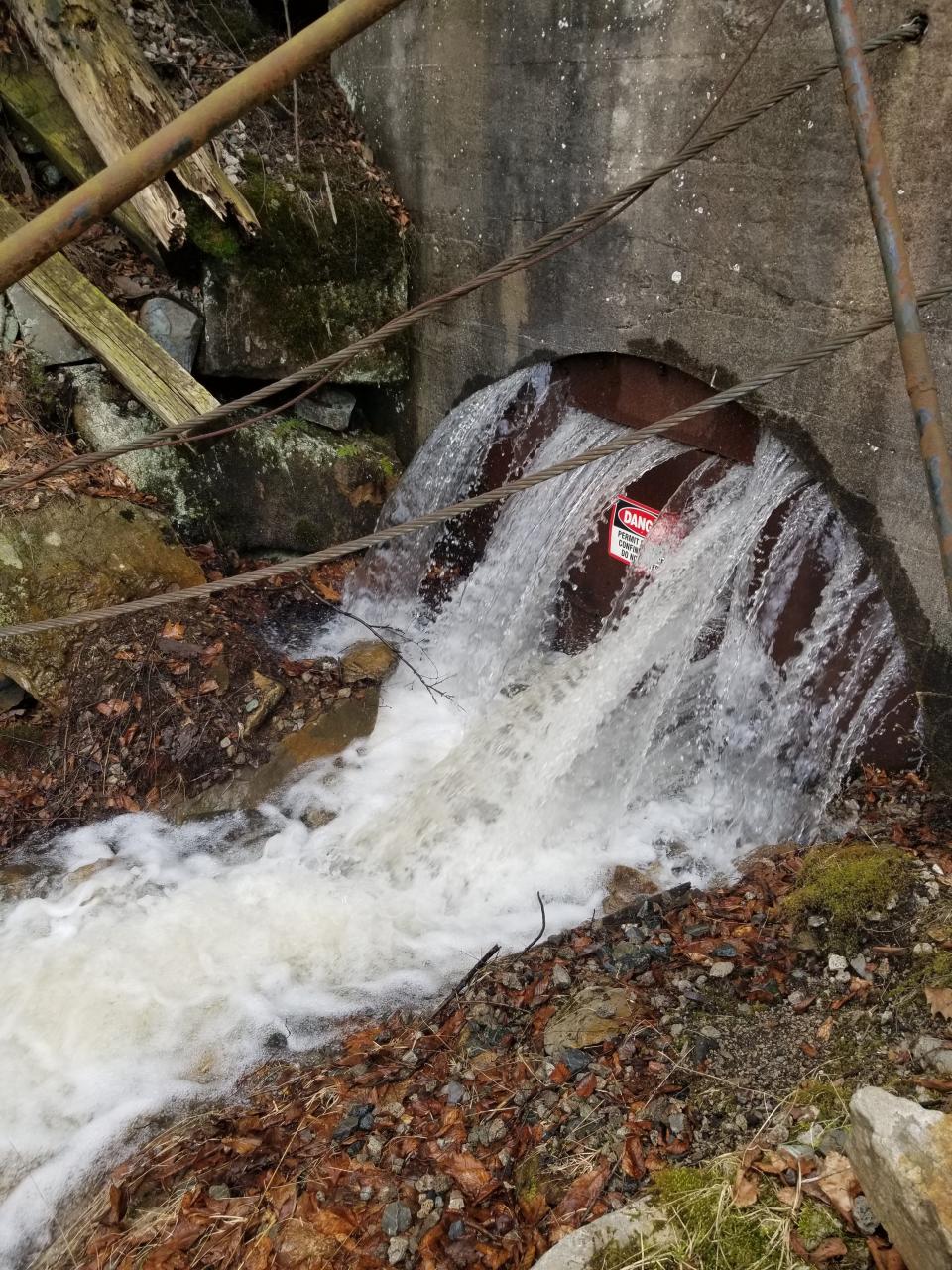 Water flowing out of the north end of the Foustwell Tunnel in Feb. 2021 after a break occurred in the century-old Quemahoning pipeline.