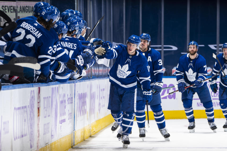 TORONTO, ON - APRIL 10: Mitchell Marner #16 of the Toronto Maple Leafs celebrates his goal with the bench against the Ottawa Senators during the second period at the Scotiabank Arena on April 10, 2021 in Toronto, Ontario, Canada. (Photo by Mark Blinch/NHLI via Getty Images)