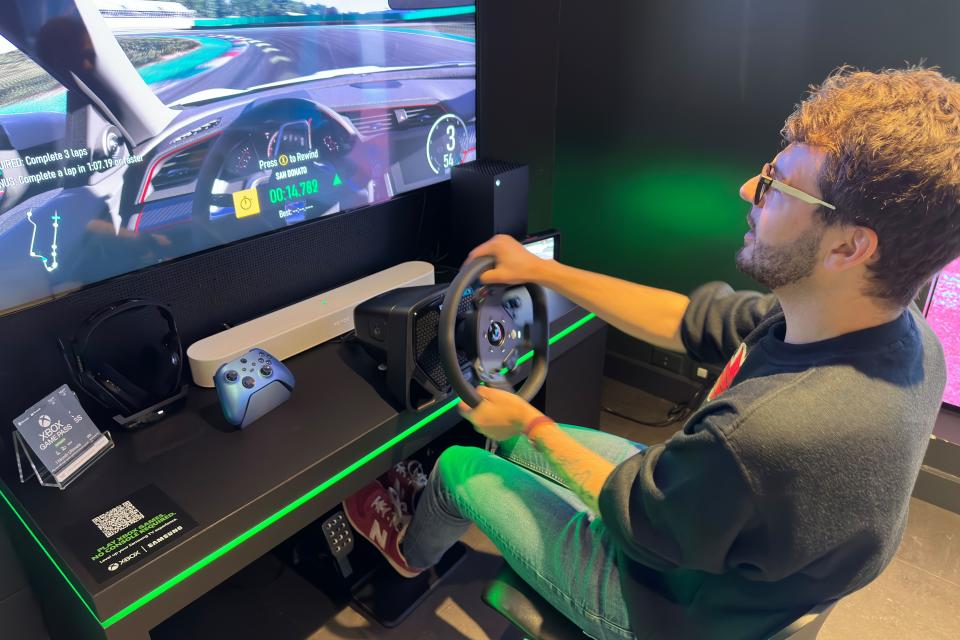 Photo of Forza Motorsport (2023) being played with a steering wheel.