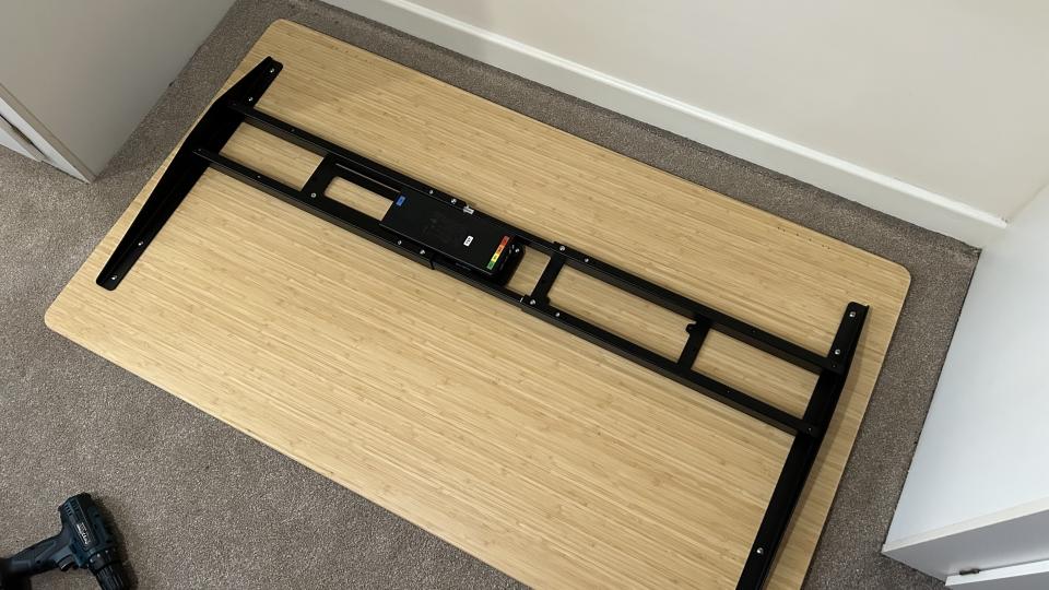 FlexiSpot E7 Pro desk on the floor during assembly