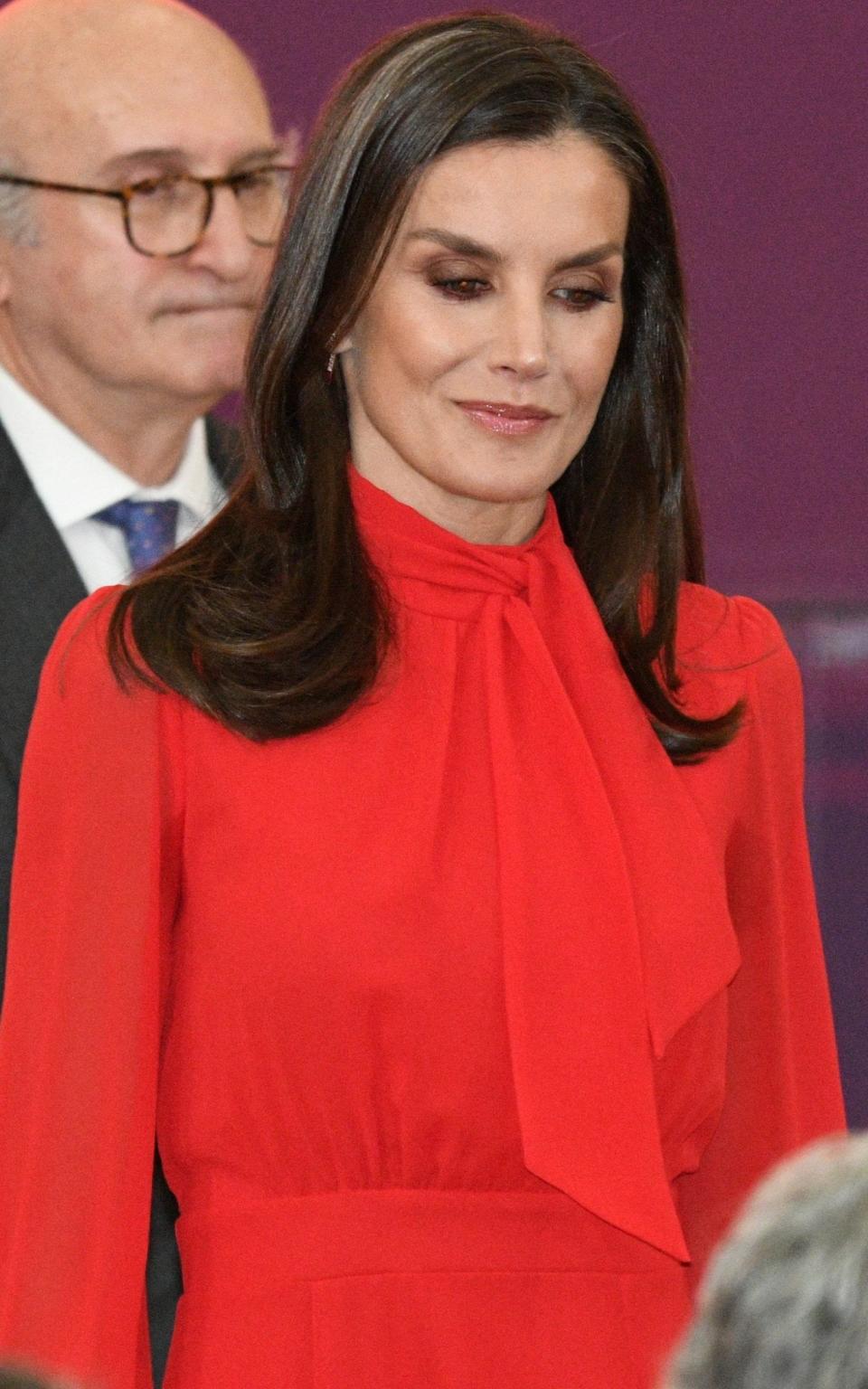 Queen Letizia of Spain wearing a red pussy-bow blouse at the Royal Palace of El Pardo in Madrid - Getty 