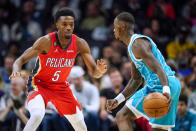 New Orleans Pelicans forward Herbert Jones (5) defends against Charlotte Hornets guard Terry Rozier during the first half of an NBA basketball game Friday, Oct. 21, 2022, in Charlotte, N.C. (AP Photo/Rusty Jones)