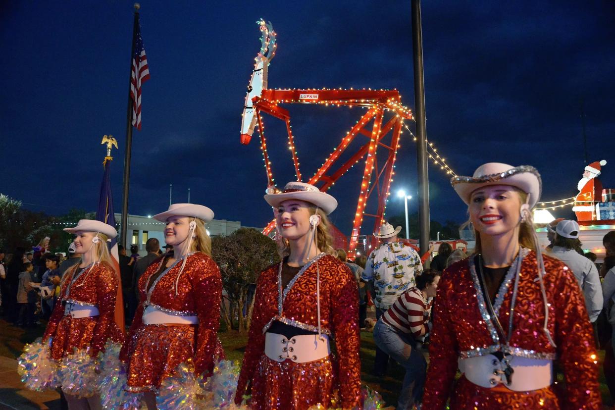 The Huntington High School High Steppers drill team stands at attention at the Rudolph the Red-Nosed Pumping Unit lighting ceremony in downtown Lufkin on Friday, Dec. 1, 2023. Credit: