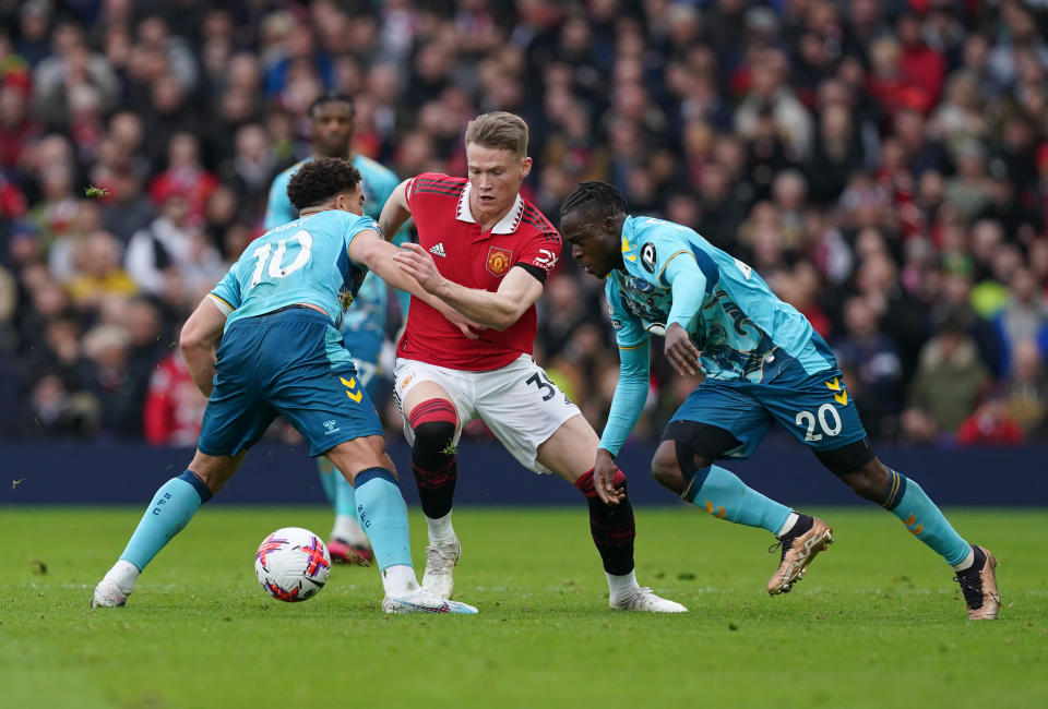 Manchester United's Scott McTominay (centre) battles for the ball with Southampton's Che Adams (left) and Kamaldeen Sulemana during their English Premier League clash.