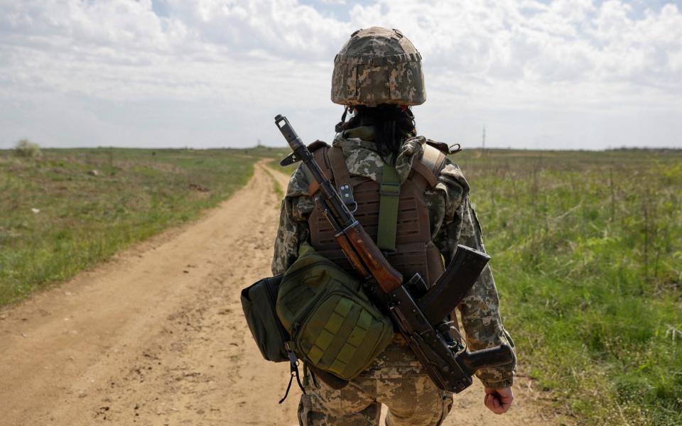 Ukrainian servicewoman walks at a position, as Russia's attack continues in Luhansk Region - Serhii Nuzhnenko/Reuters