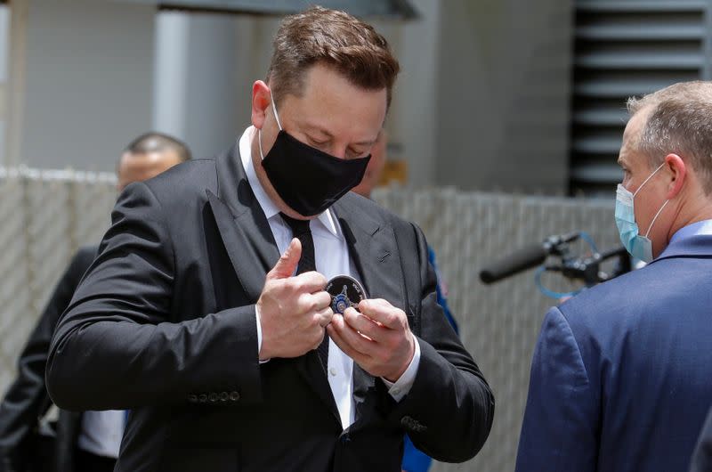 SpaceX founder Elon Musk and NASA Administrator Jim Bridenstine attend the walkout of NASA astronauts Douglas Hurley and Robert Behnken before the launch of a SpaceX Falcon 9 rocket and Crew Dragon spacecraft at the Kennedy Space Center, in Cape Canaveral