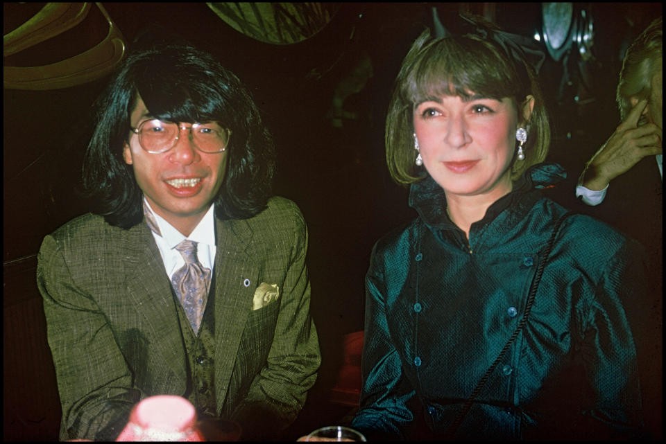 Fashion designer Kenzo Takada and a friend at a party at "Maxim' s" in 1986 . (Photo by Bertrand Rindoff Petroff/Getty Images)