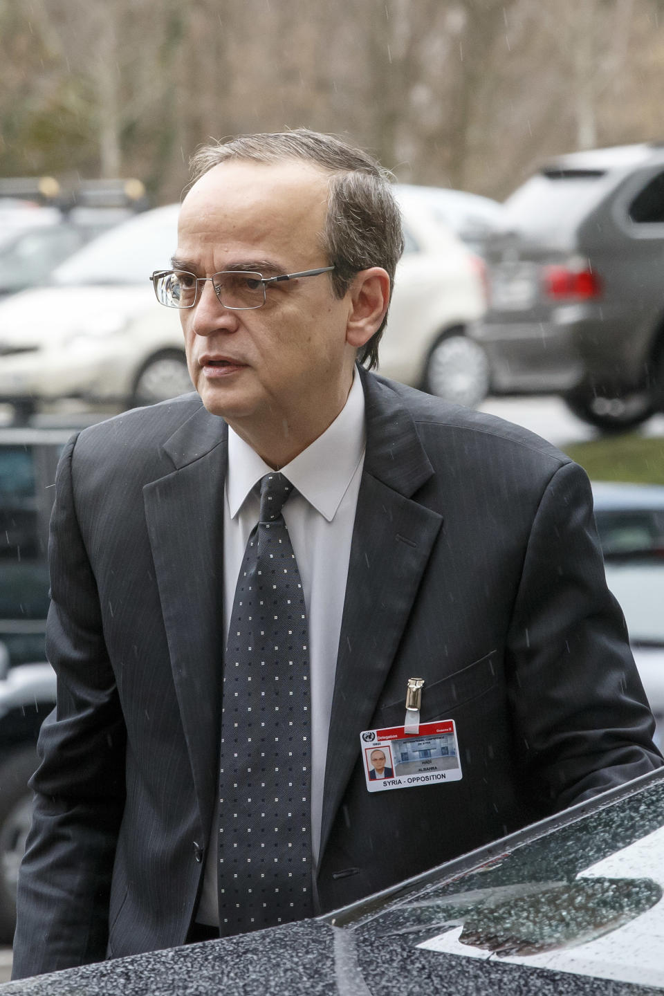 Syrian opposition chief negotiator Hadi Bahra, right, arrives for a meeting at the European headquarters of the United Nations, during the second round of negotiation between the Syrian government and the opposition, in Geneva, Switzerland, Friday, Feb. 14, 2014. (AP Photo/Keystone, Salvatore Di Nolfi)