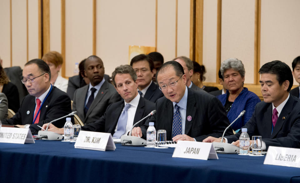 In this photo released by World Bank, World Bank President Jim Yong Kim, second right, speaks as South Korean Finance Minister Bahk Jae-wan, left, U.S. Treasury Secretary Timothy Geithner, second left, and Japan's Vice Finance Minister Tsutomu Okubo, right, listen to him at a ministerial meeting on the global agriculture and food security program at the annual meetings of the IMF and World Bank meetings in Tokyo Friday, Oct. 12, 2012. (AP Photo/Ryan Rayburn, World Bank) EDITORIAL USE ONLY