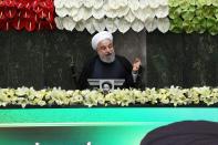 Iranian President Hassan Rouhani speaks during the opening ceremony of Iran's 11th parliament, as the spread of the coronavirus disease (COVID-19) continues, in Tehran